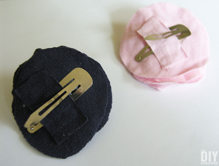 Back of navy and pink flower clips made with t-shirts.