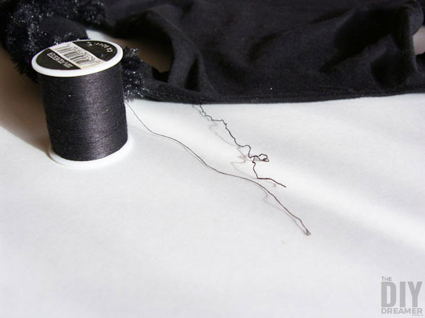 Noticed this loose/unravelled thread along the stitching on