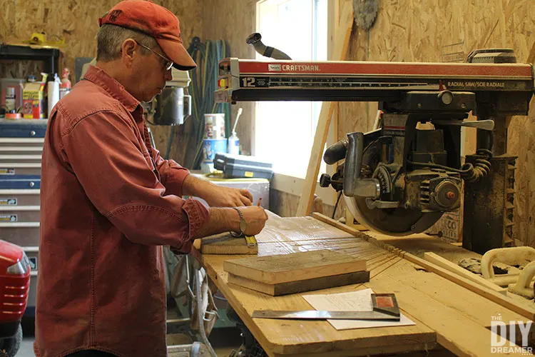 Measuring wood to cut pieces to make bluebird birdhouse.