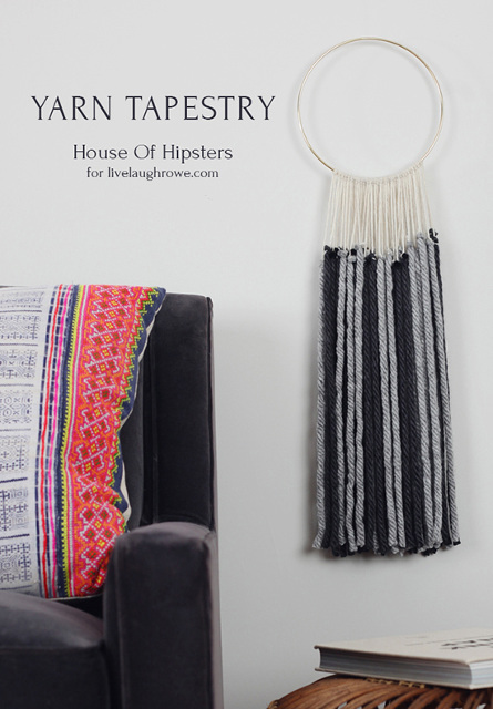 A DIY Yarn Tapestry tutorial. Create this beautiful macrame inspired wall hanging with yarn and a brass hoop. Just tie a few knots.