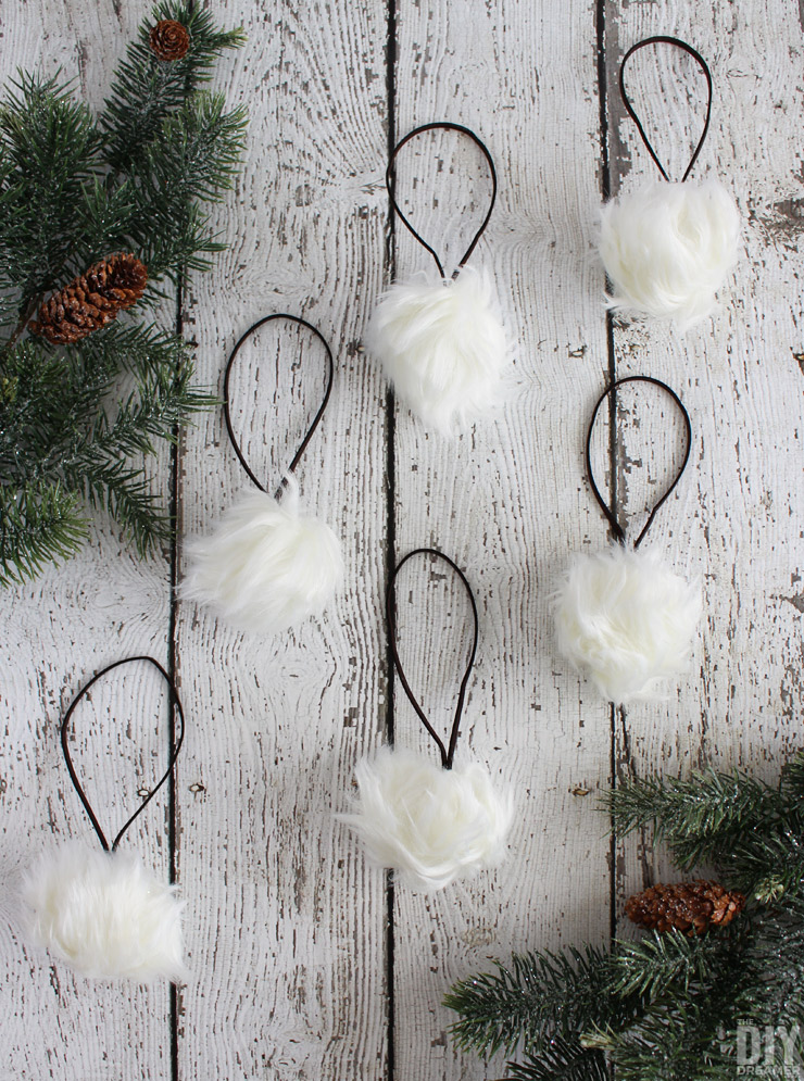 Add a fun touch of rustic to your Rustic Christmas with these DIY Faux Fur Pom Pom Christmas Ornaments! Also perfect for a Woodland Christmas theme!