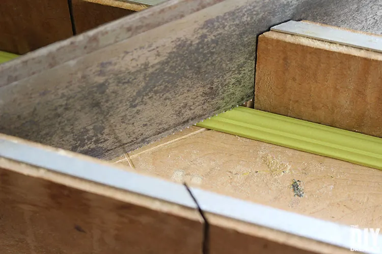 Use a miter box and hand saw to cut moulding to size.