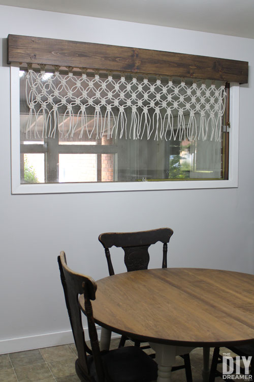 Wooden window cornice with macrame valance.