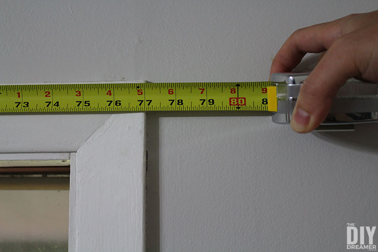 Measure window and window frame to determine the length.