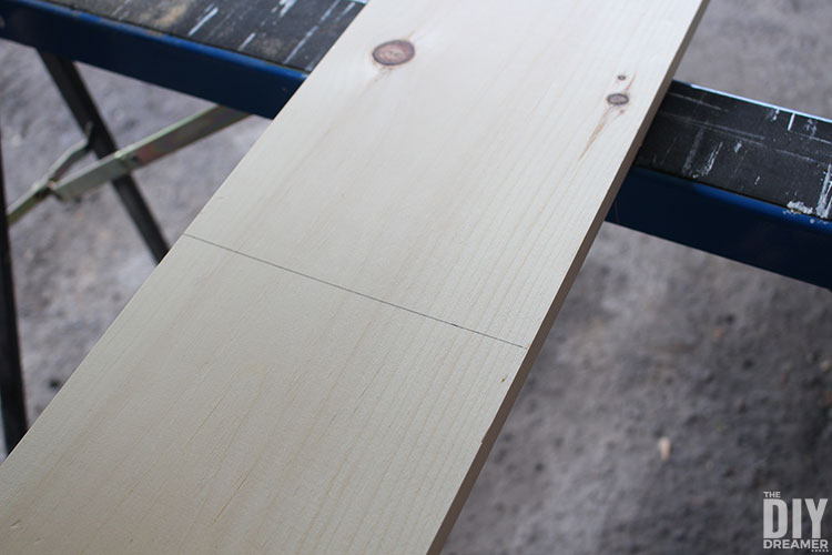 Pine board with cut line.