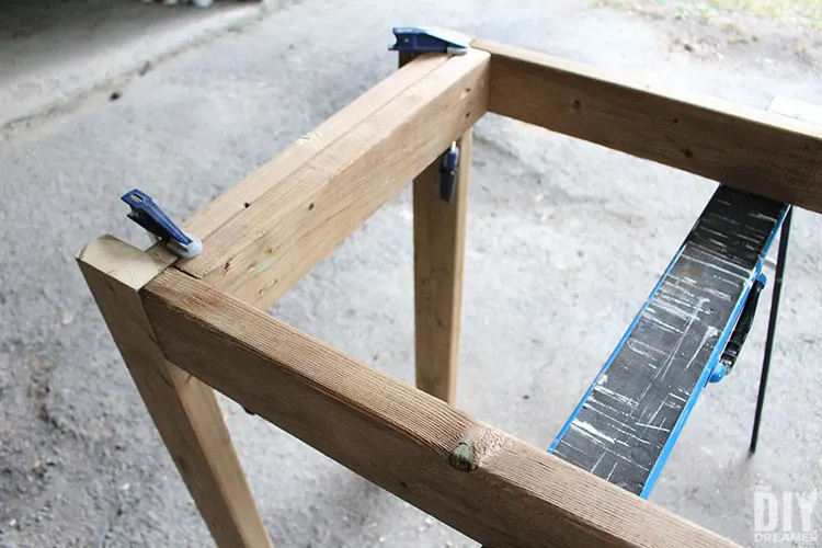 Attaching legs to the table frame.