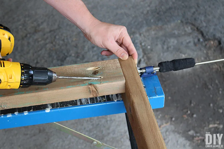 Attach board to side to create legs for the table.