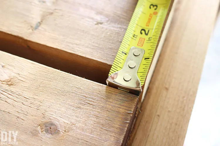 Measuring the spacing between the boards.
