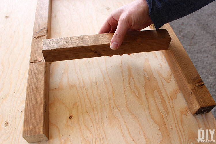 Add bottom piece to the side frame