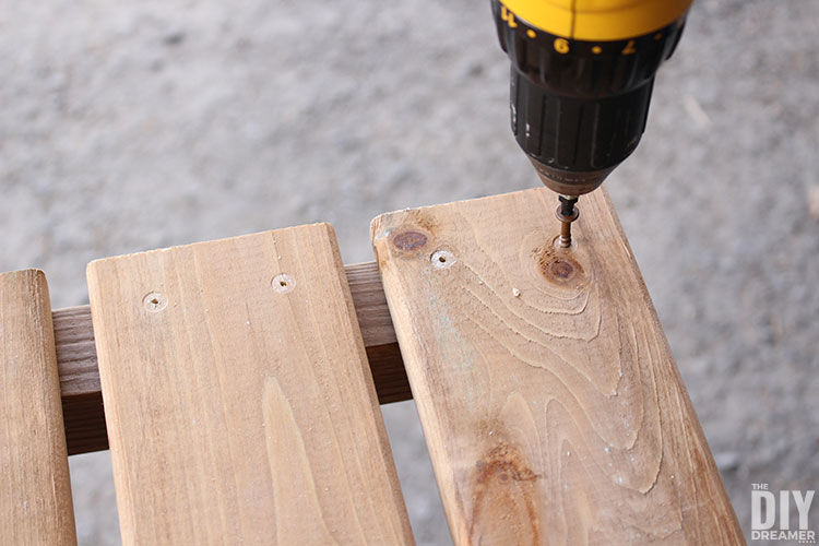 Attach seat onto the stool with screws