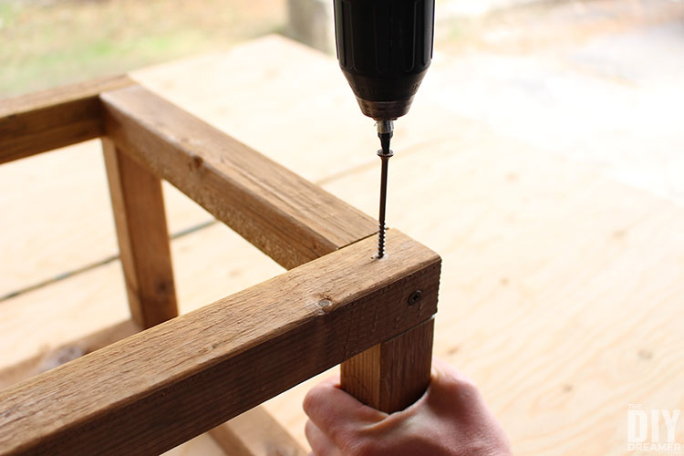 Insert screws in pilot holes