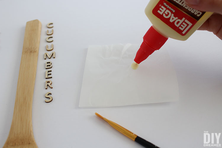 Putting carpenters glue on a piece of wax paper.