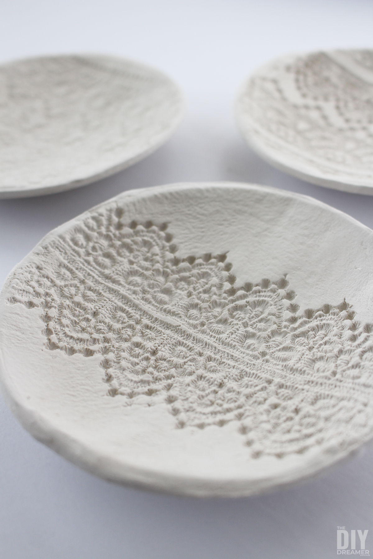 Closeup of lace clay bowl.